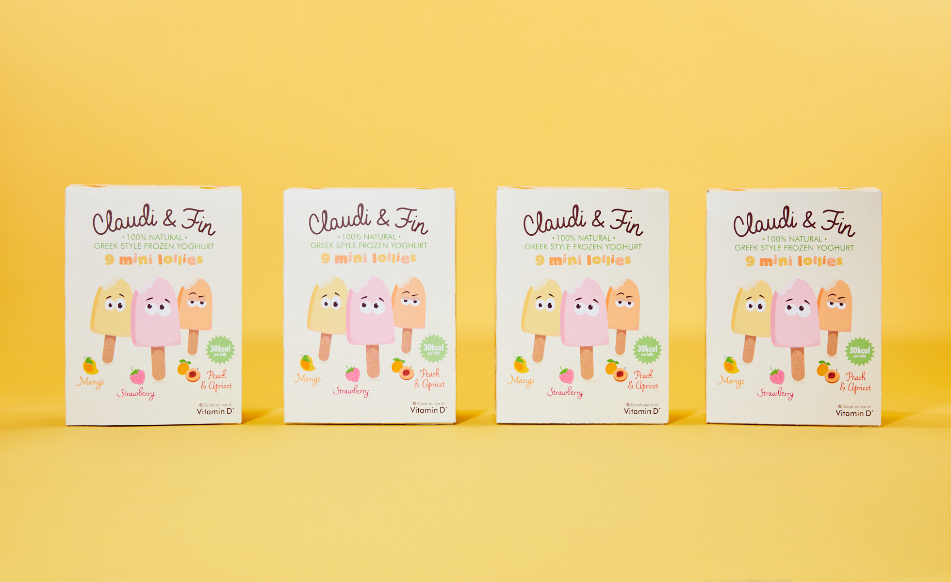 Four boxes of Claudi and Fin lollies lined up against a yellow background