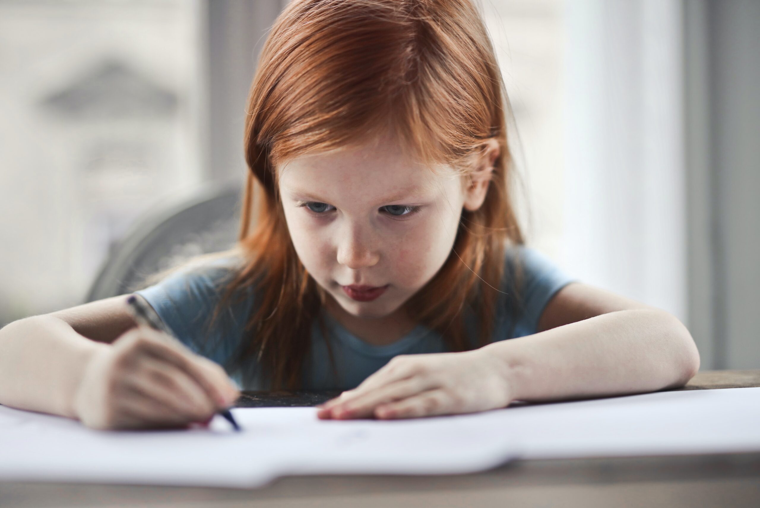 child writing a journal