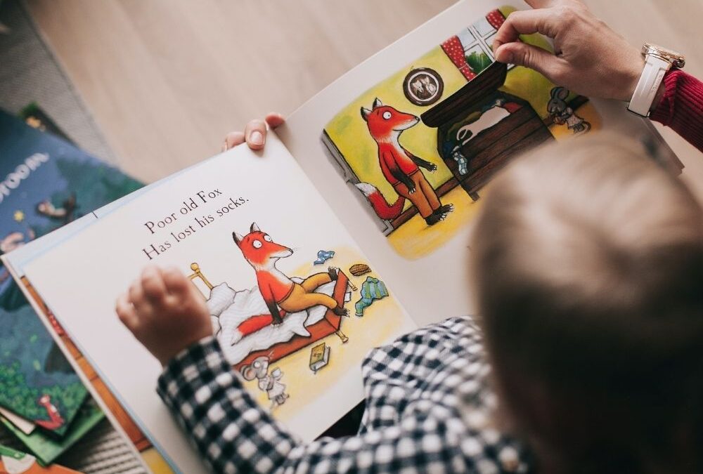 Toddler reading picture book