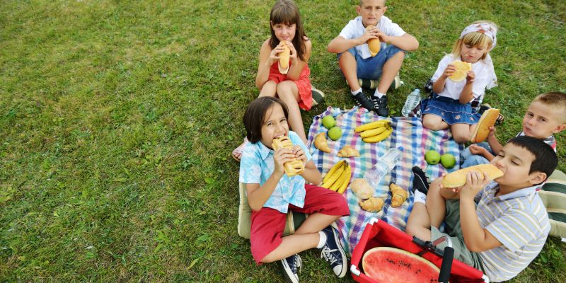 Friends on a picnic blanket